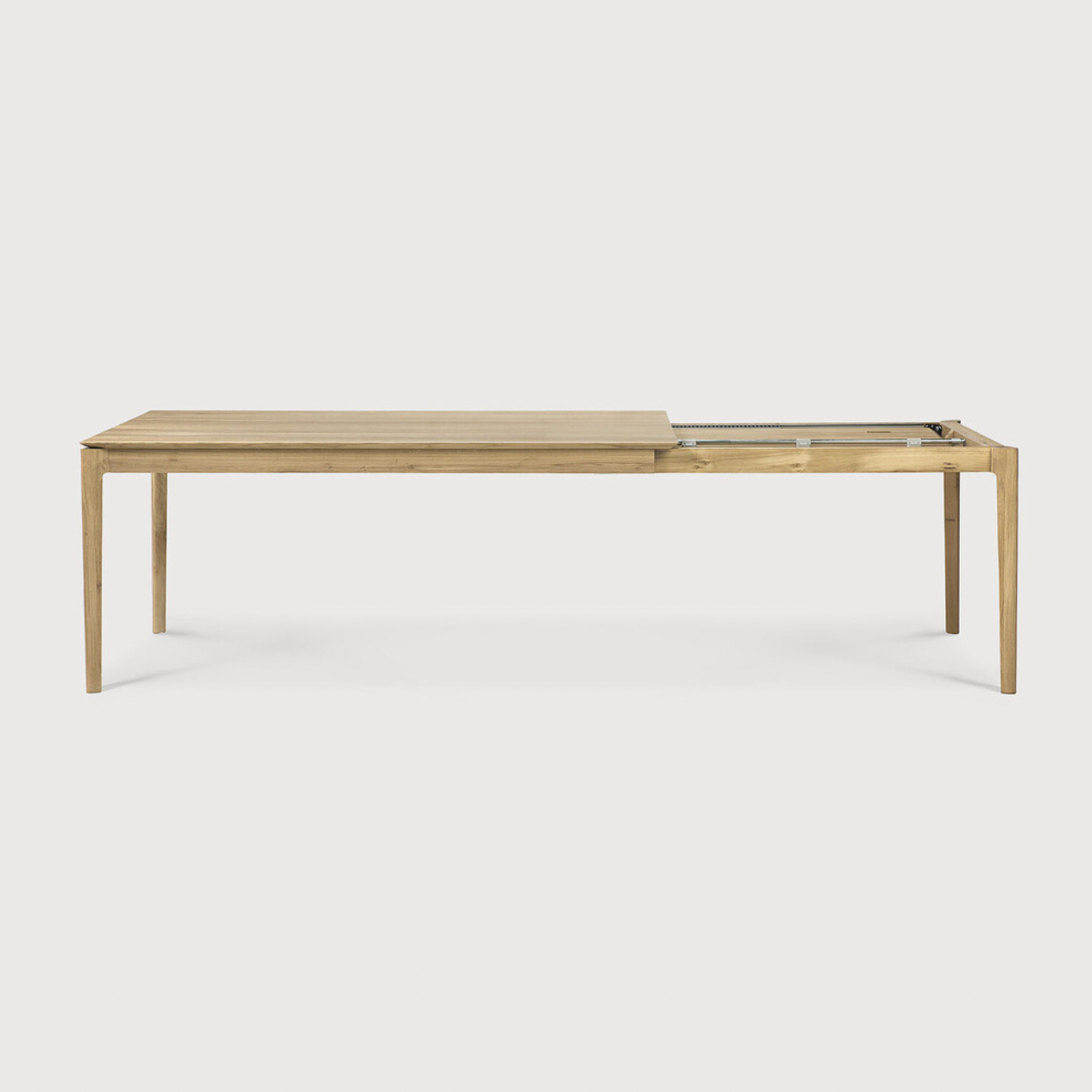 This Oak Bok Extendable Dining Table is perfect for families who want extra space when their kids, extended family, or guests come to celebrate! Its airy shape yet rock solid construction make this piece a timeless and remarkable design to enjoy for years to come.  Material: Oak, 100% Solid Wood Finish: Oiled