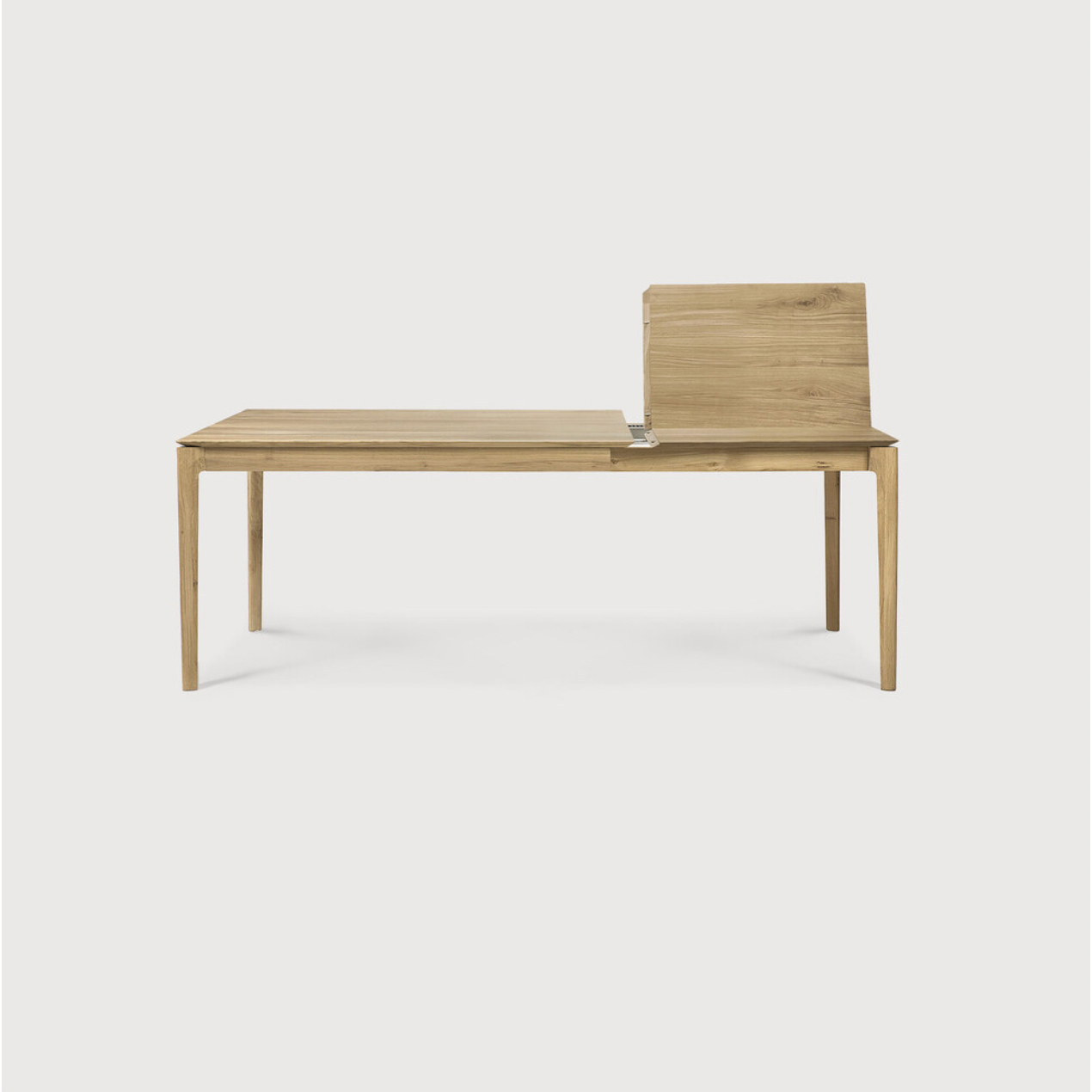 This Oak Bok Extendable Dining Table is perfect for families who want extra space when their kids, extended family, or guests come to celebrate! Its airy shape yet rock solid construction make this piece a timeless and remarkable design to enjoy for years to come.  Material: Oak, 100% Solid Wood Finish: Oiled
