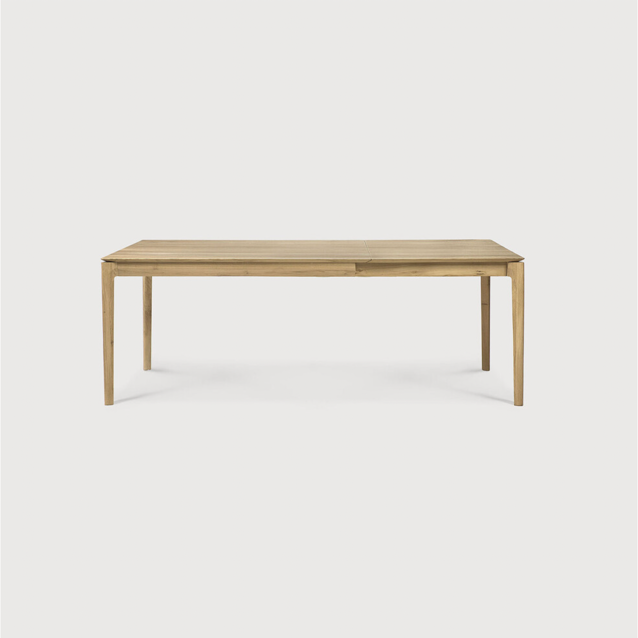 This Oak Bok Extendable Dining Table is perfect for families who want extra space when their kids, extended family, or guests come to celebrate! Its airy shape yet rock solid construction make this piece a timeless and remarkable design to enjoy for years to come.  Material: Oak, 100% Solid Wood Finish: Oiled