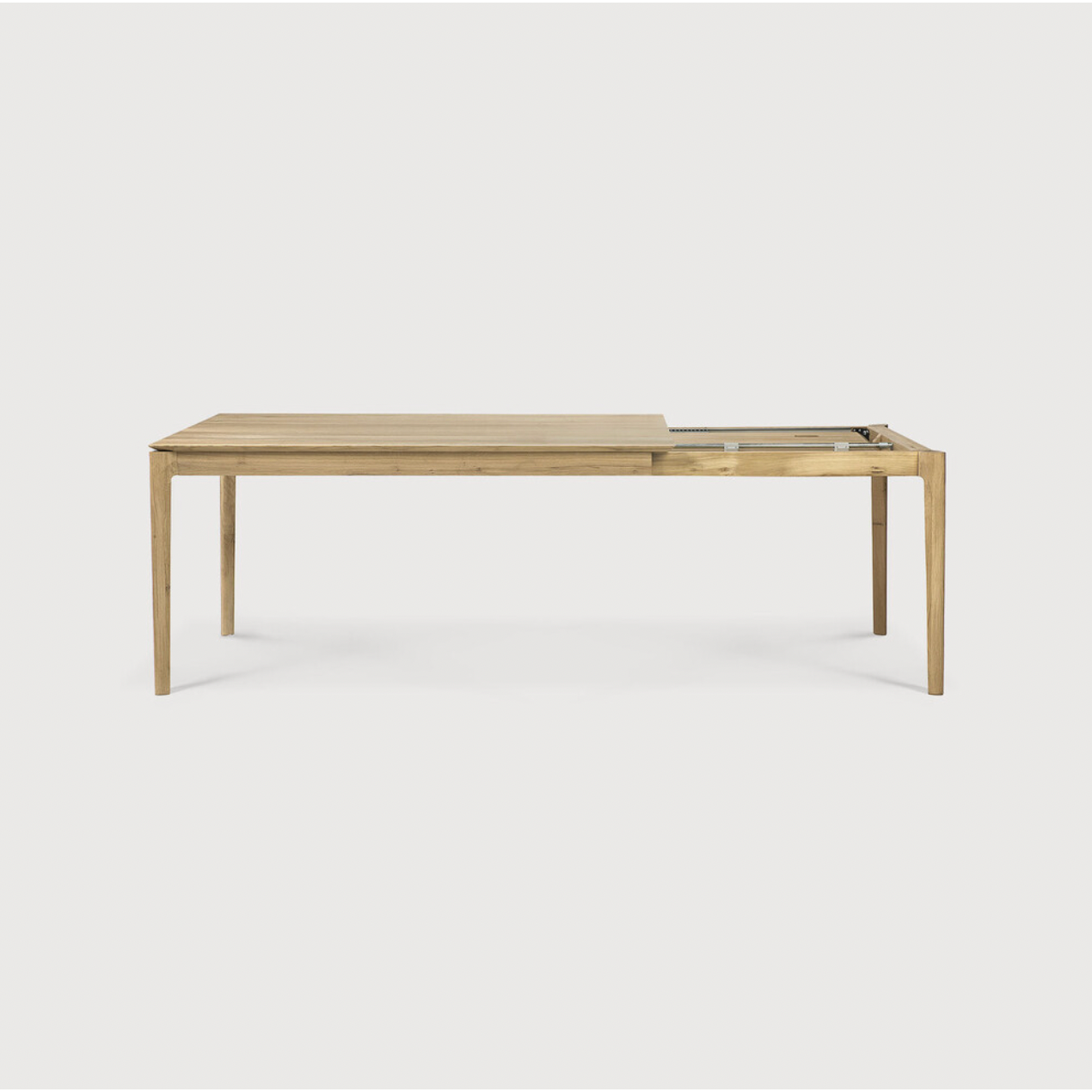 This Oak Bok Extendable Dining Table is perfect for families who want extra space when their kids, extended family, or guests come to celebrate! Its airy shape yet rock solid construction make this piece a timeless and remarkable design to enjoy for years to come.  Material: Oak, 100% Solid Wood Finish: Oiled