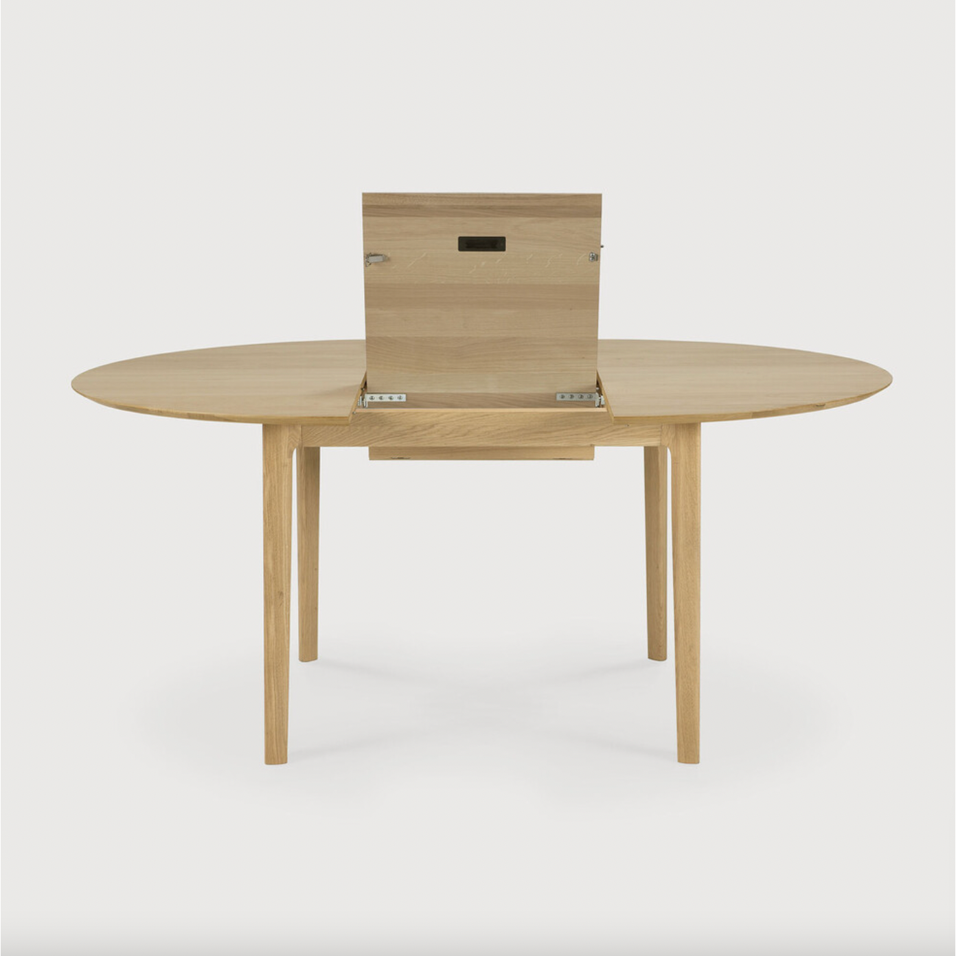 This Oak Bok Round Extendable Dining Table offers the perfect solution for adaptable dining within a smaller space. The iconic airy shape and solid construction make for a timeless design to enjoy for years to come.  Material: Oak, 100% Solid Wood Finish: Oiled