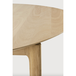 This Oak Bok Round Extendable Dining Table offers the perfect solution for adaptable dining within a smaller space. The iconic airy shape and solid construction make for a timeless design to enjoy for years to come.  Material: Oak, 100% Solid Wood Finish: Oiled