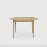 This Oak Bok Round Extendable Dining Table offers the perfect solution for adaptable dining within a smaller space. The iconic airy shape and solid construction make for a timeless design to enjoy for years to come.  Material: Oak, 100% Solid Wood Finish: Oiled