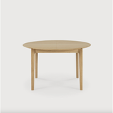 This Oak Bok Round Extendable Dining Table offers the perfect solution for adaptable dining within a smaller space. The iconic airy shape and solid construction make for a timeless design to enjoy for years to come.  Material: Oak, 100% Solid Wood Finish: Oiled