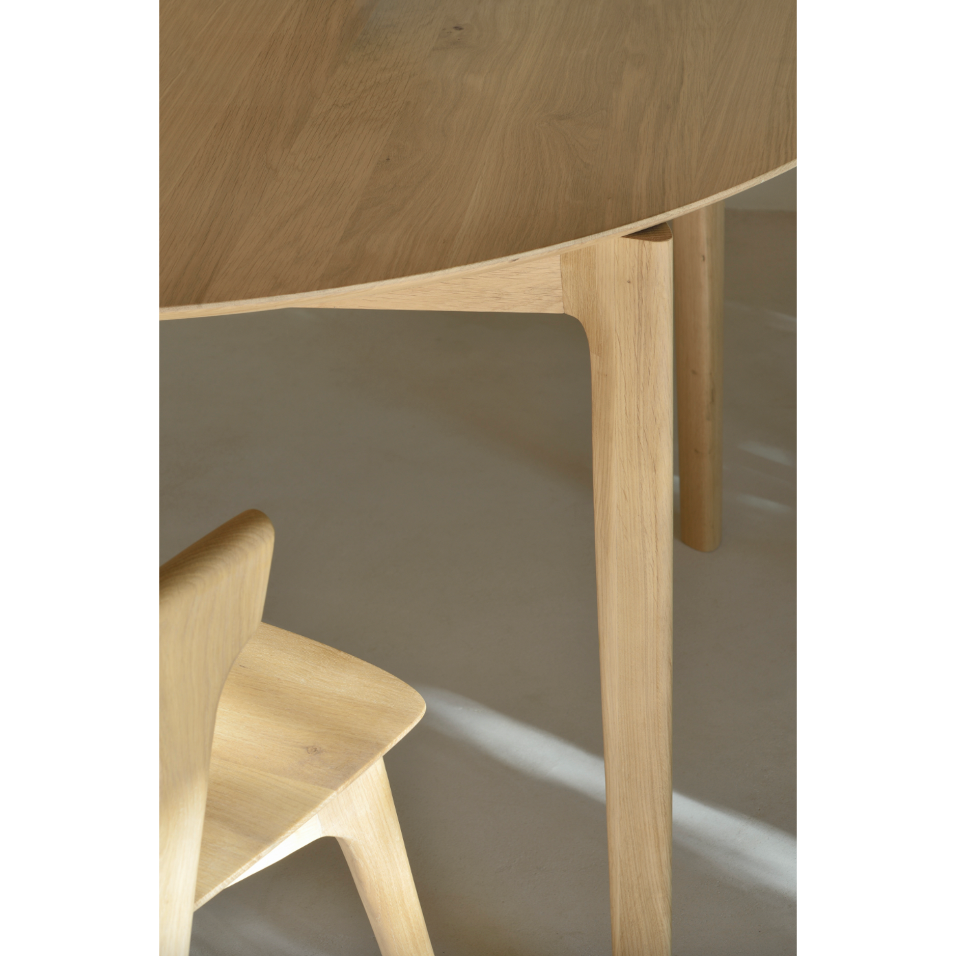 This Oak Bok Round Extendable Dining Table offers the perfect solution for adaptable dining within a smaller space. The iconic airy shape and solid construction make for a timeless design to enjoy for years to come.  Material: Oak, 100% Solid Wood Finish: Oiled