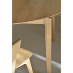 This Oak Bok Round Extendable Dining Table offers the perfect solution for adaptable dining within a smaller space. The iconic airy shape and solid construction make for a timeless design to enjoy for years to come.  Material: Oak, 100% Solid Wood Finish: Oiled