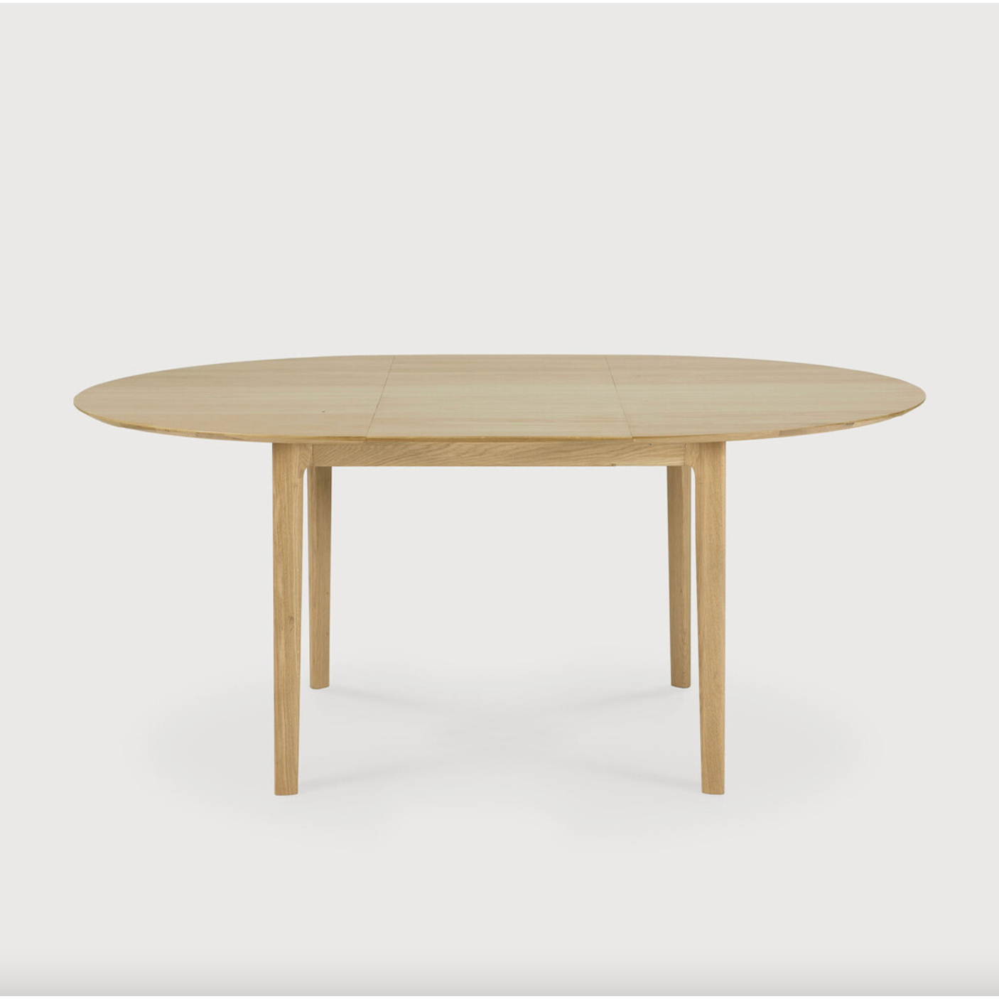 This Oak Bok Round Extendable Dining Table offers the perfect solution for adaptable dining within a smaller space. The iconic airy shape and solid construction make for a timeless design to enjoy for years to come.  Material: Oak, 100% Solid Wood Finish: Oiled