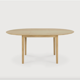 This Oak Bok Round Extendable Dining Table offers the perfect solution for adaptable dining within a smaller space. The iconic airy shape and solid construction make for a timeless design to enjoy for years to come.  Material: Oak, 100% Solid Wood Finish: Oiled