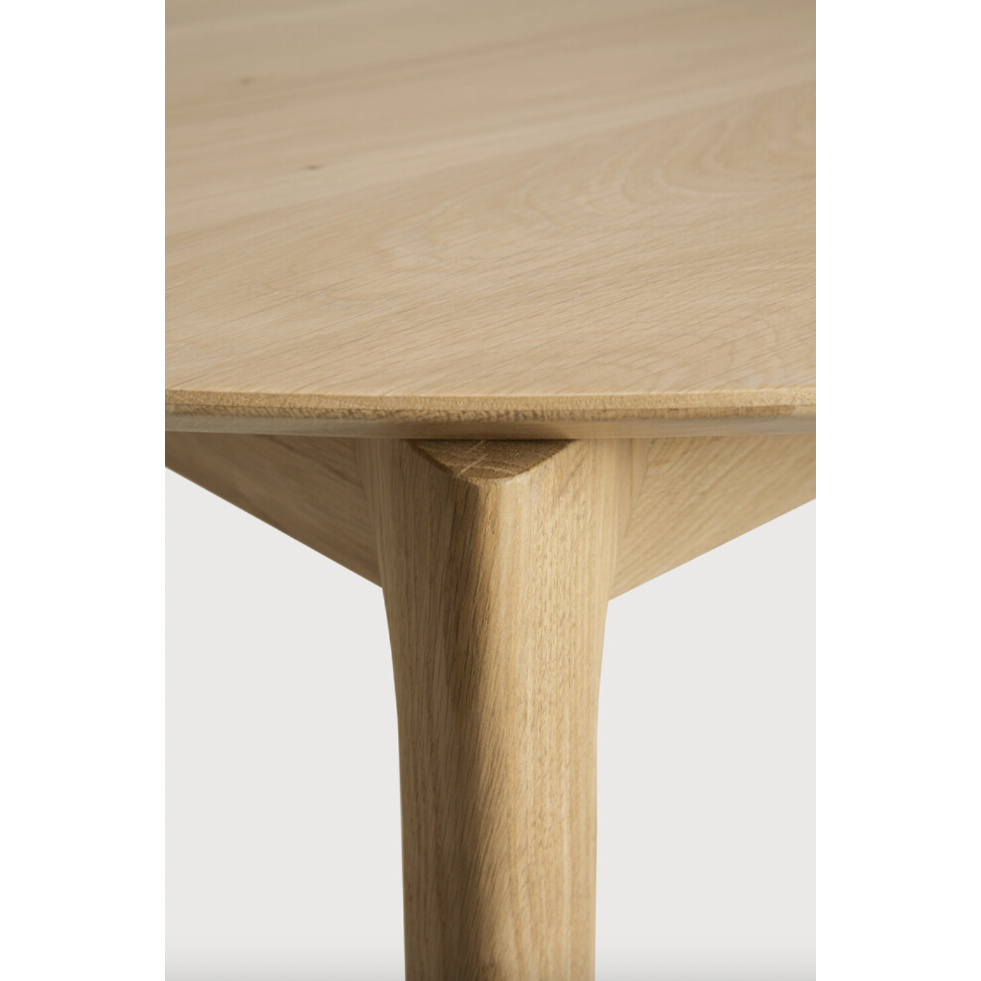 This Oak Bok Round Extendable Dining Table offers the perfect solution for adaptable dining within a smaller space. The iconic airy shape and solid construction make for a timeless design to enjoy for years to come.  Material: Oak, 100% Solid Wood Finish: Oiled