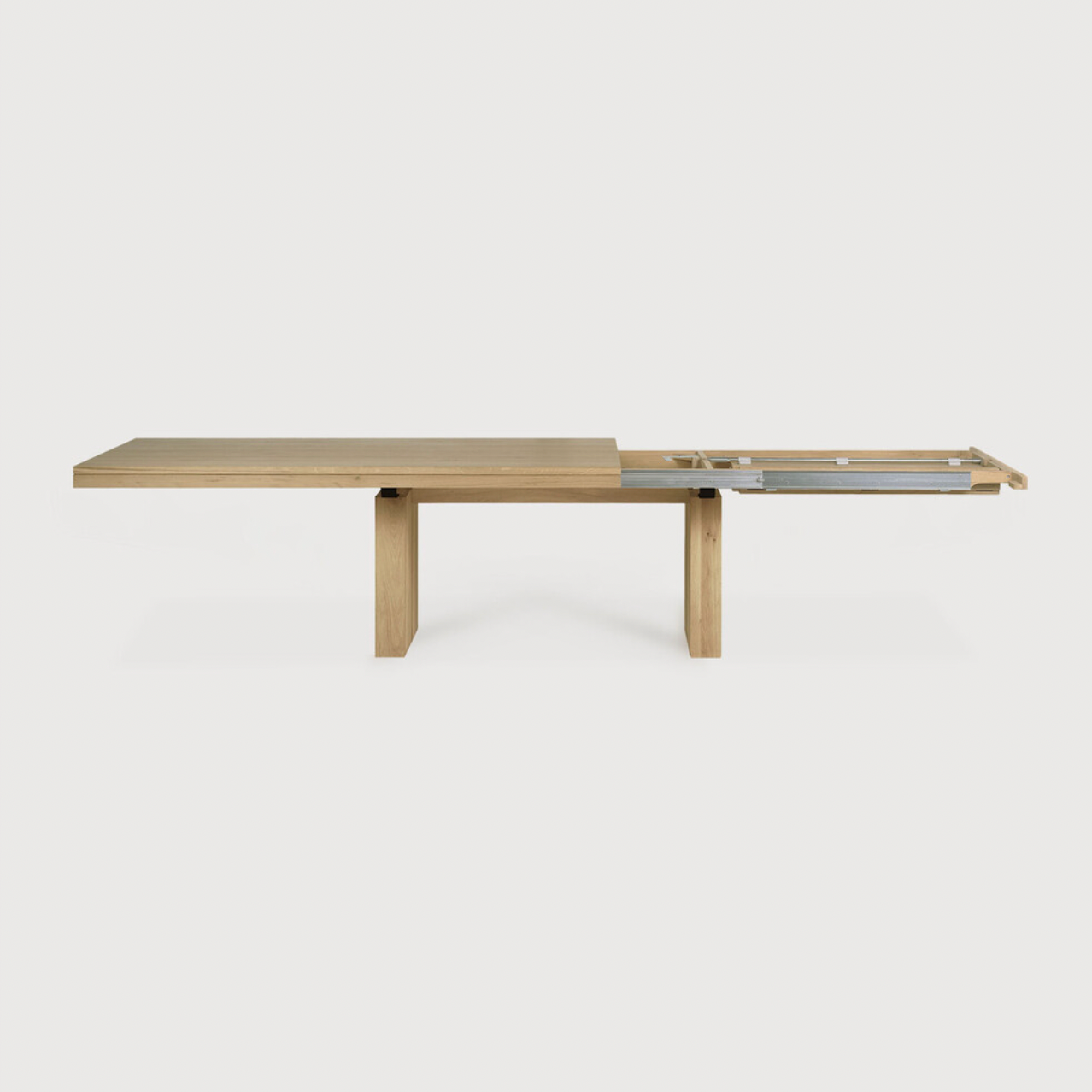 We love the solid look and pure lines of this Oak Double Extendable Dining Table.   Although the table looks heavy, it can very easily be extended single-handedly. It takes a few steps and no more than seconds to make space for whatever will be happening next in your home!  Material: Oak, 100% Solid Wood Finish: Oak  