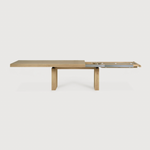 We love the solid look and pure lines of this Oak Double Extendable Dining Table.   Although the table looks heavy, it can very easily be extended single-handedly. It takes a few steps and no more than seconds to make space for whatever will be happening next in your home!  Material: Oak, 100% Solid Wood Finish: Oak  