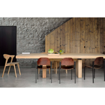 We love the solid look and pure lines of this Oak Double Extendable Dining Table.   Although the table looks heavy, it can very easily be extended single-handedly. It takes a few steps and no more than seconds to make space for whatever will be happening next in your home!  Material: Oak, 100% Solid Wood Finish: Oak  
