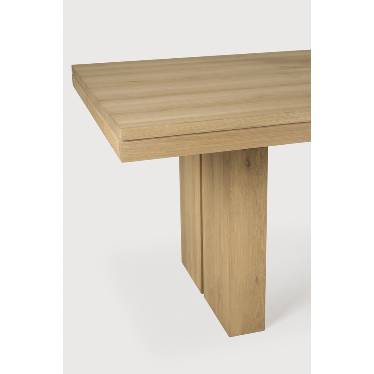 We love the solid look and pure lines of this Oak Double Extendable Dining Table.   Although the table looks heavy, it can very easily be extended single-handedly. It takes a few steps and no more than seconds to make space for whatever will be happening next in your home!  Material: Oak, 100% Solid Wood Finish: Oak  