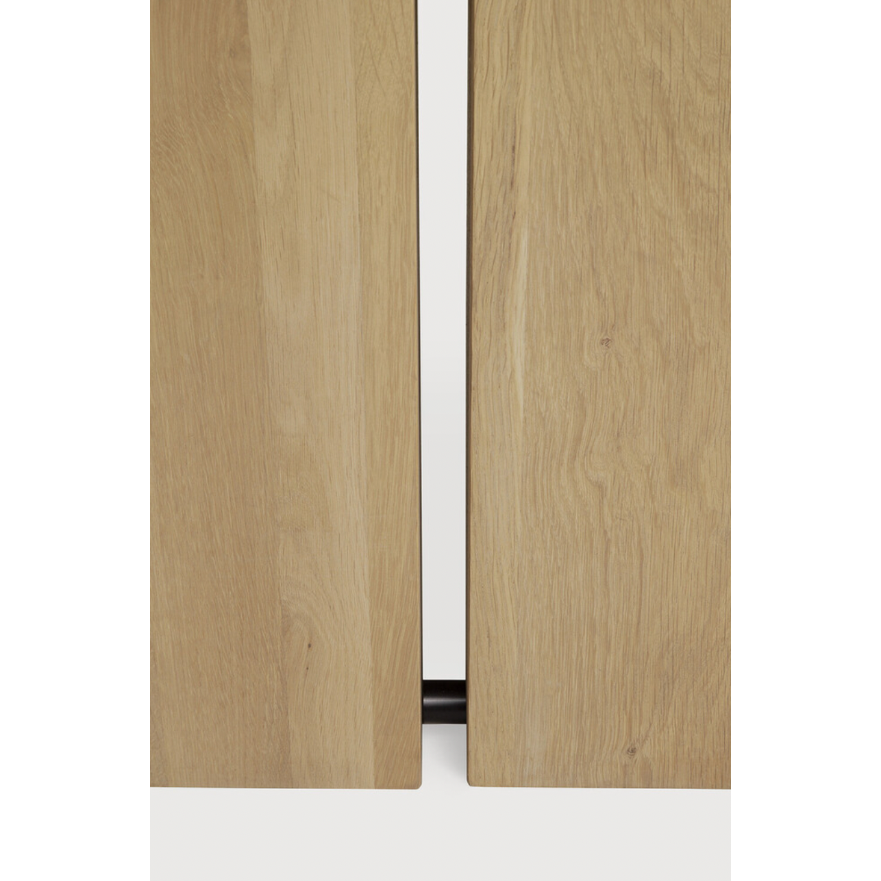 We love the solid look and pure lines of this Oak Double Extendable Dining Table.   Although the table looks heavy, it can very easily be extended single-handedly. It takes a few steps and no more than seconds to make space for whatever will be happening next in your home!  Material: Oak, 100% Solid Wood Finish: Oak  