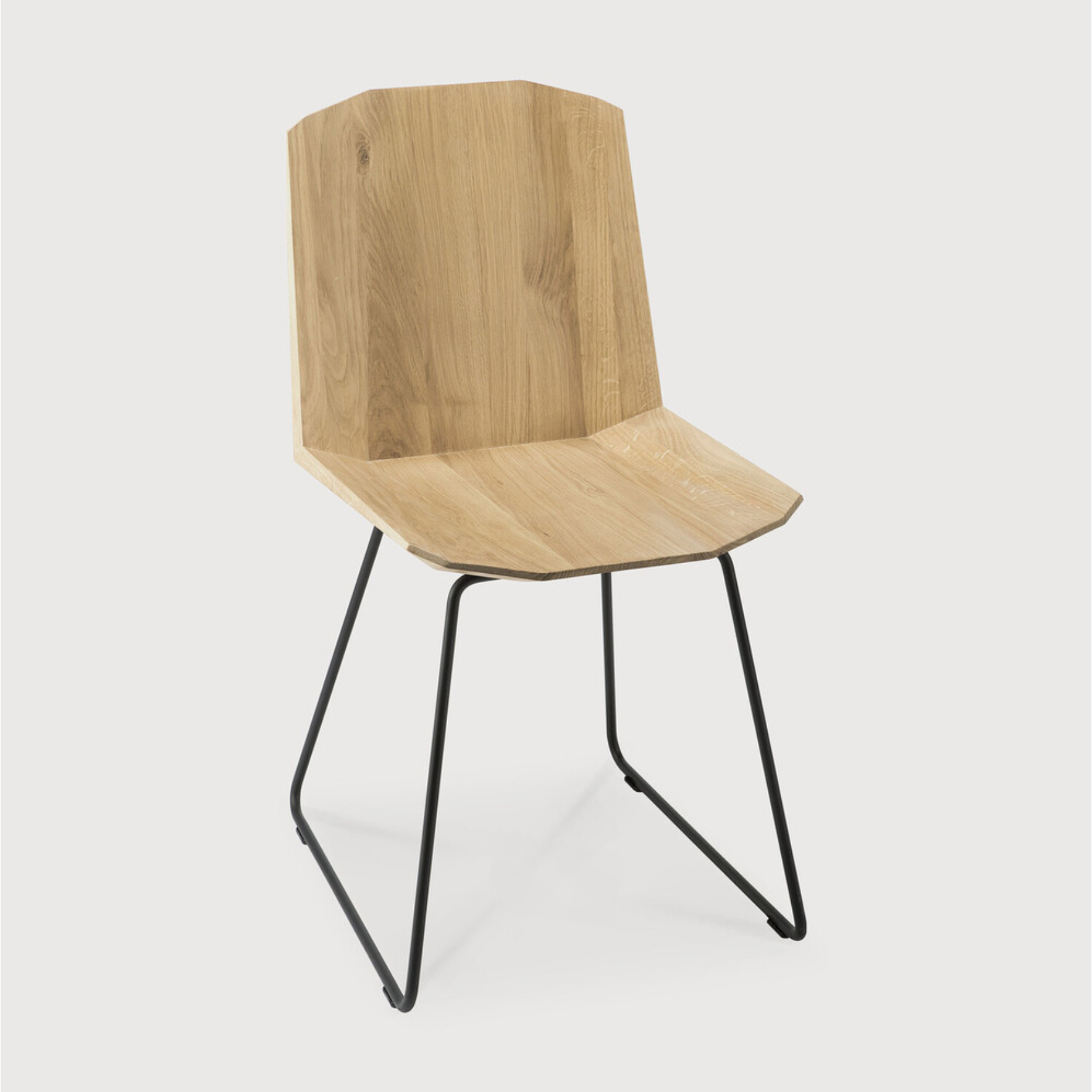 This Oak Facette Dining Chair is both timeless, yet reflecting. We are so intrigued by this chair's ingenious wooden structure that is divided into facets, which makes the seating more comfortable and unique. This beautiful chair will add a sculptural element to your dining table or kitchen!  Dimensions: 17"w x 21"d x 33"h  Weight: 18 lbs  Seat Height: 19"  Material: Oak, 100% solid wood Finish Options: Oiled