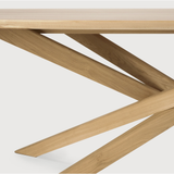 This Oak Mikado Dining Table - Oval by Alain Van Havre is all about inspiring your family to spend a little more time at the table. We love that the solid legs intertwine in perfect balance to elevate the look to any dining room or kitchen area.   Material: Oak, 100% Solid Wood Finish: Oiled