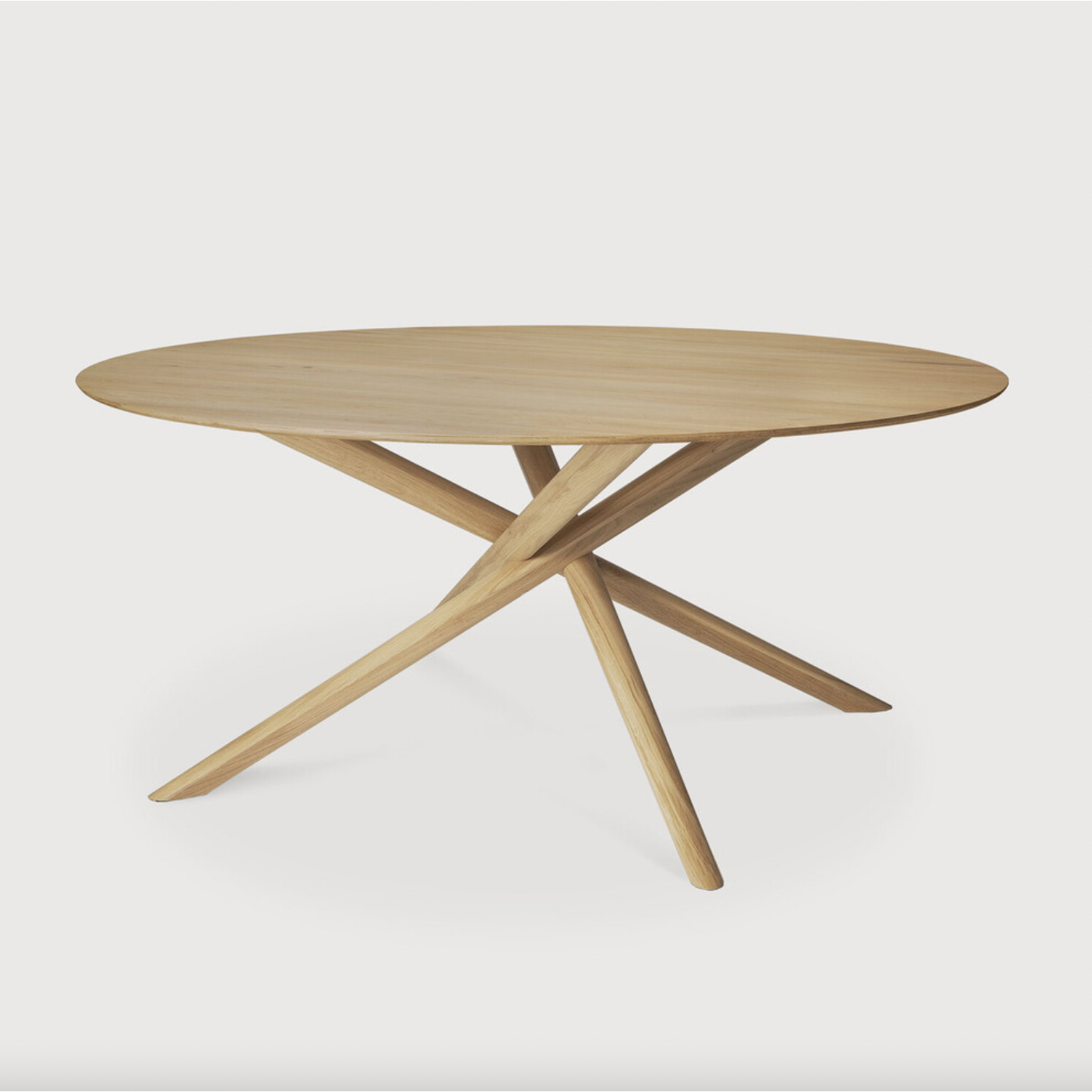 We love the sculptural character of this Oak Mikado Dining Table - Round. The legs interlock like a well-thought-out puzzle, making it easier to interact with your guests and allows you to converse with your family and friends for years to come!  Designed by Alain van Havre  Material: Oak, 100% Solid Wood Finish: Oiled