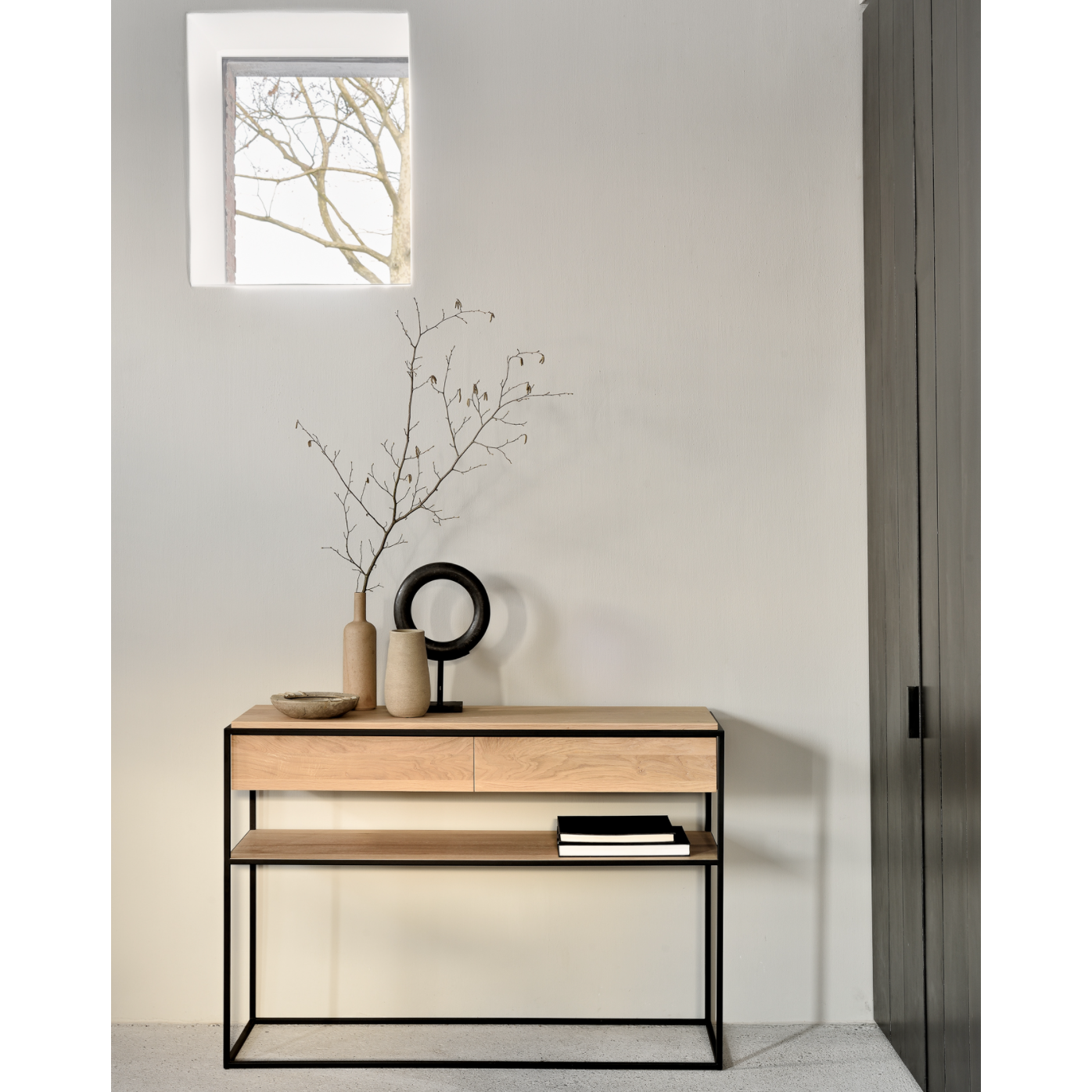 Balance and function come together in the Monolit console table. This simple, sleek table includes storage and we LOVE hidden storage! Dress up your living room or office with a piece that is both functional and stylish!  Dimensions: 48.5"w x 16"d x 33.5"h  Weight: 77 lbs  Material: Oak, 100% solid wood Finish: Oiled