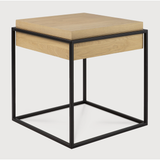 Balance and function come together in the Monolit side table. This simple, sleek table includes storage and we LOVE hidden storage! Dress up your living room or office with a piece that is both functional and stylish!  Dimensions: 19"w x 19"d x 20.5"h  Weight: 22 lbs  Material: Oak, 100% solid wood Finish: Oiled