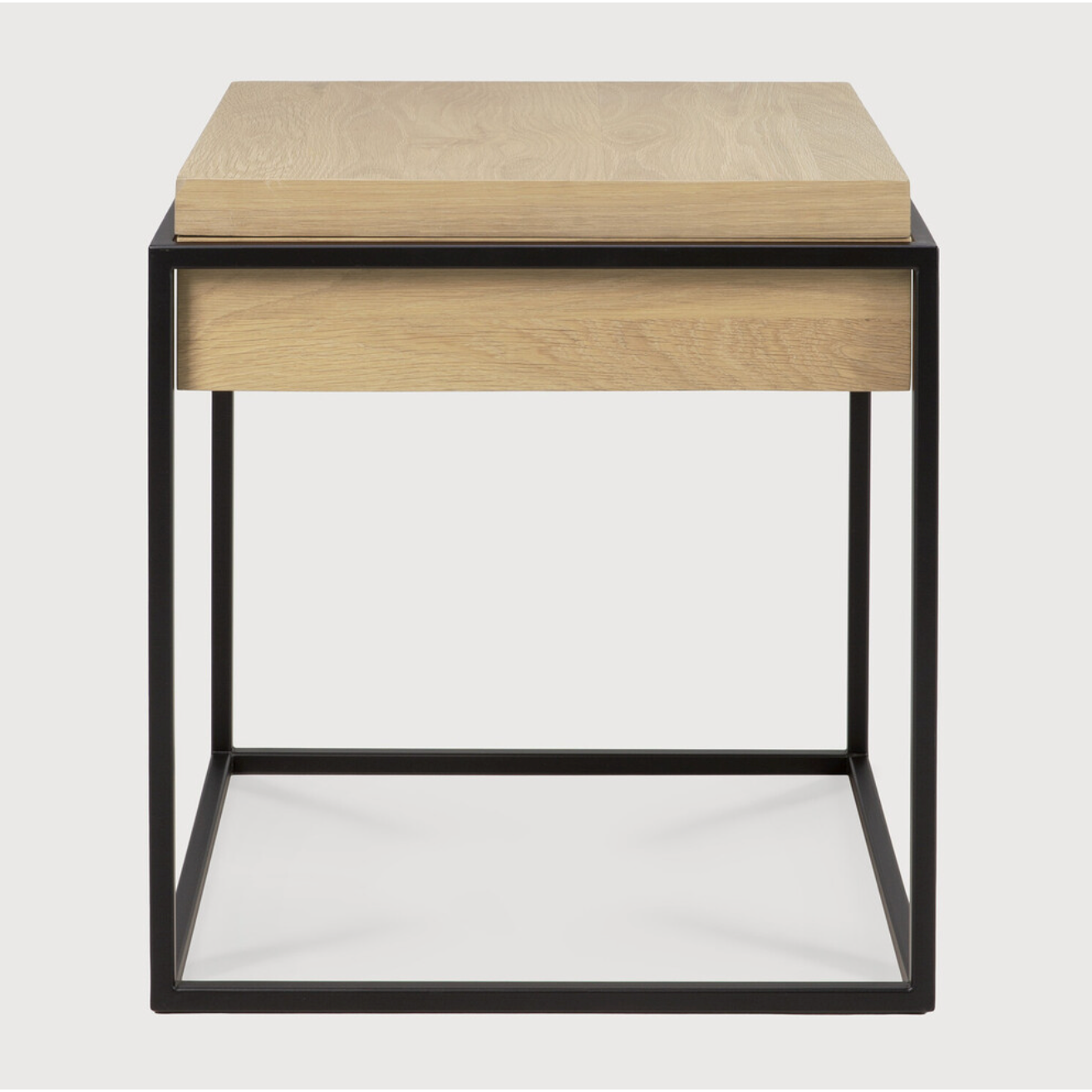 Balance and function come together in the Monolit side table. This simple, sleek table includes storage and we LOVE hidden storage! Dress up your living room or office with a piece that is both functional and stylish!  Dimensions: 19"w x 19"d x 20.5"h  Weight: 22 lbs  Material: Oak, 100% solid wood Finish: Oiled