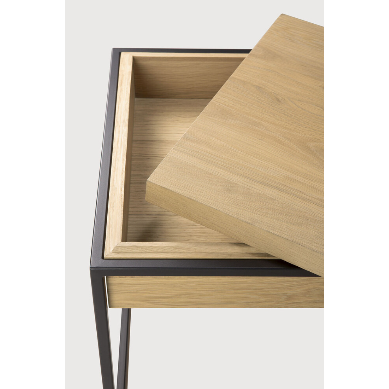 Balance and function come together in the Monolit side table. This simple, sleek table includes storage and we LOVE hidden storage! Dress up your living room or office with a piece that is both functional and stylish!  Dimensions: 19"w x 19"d x 20.5"h  Weight: 22 lbs  Material: Oak, 100% solid wood Finish: Oiled