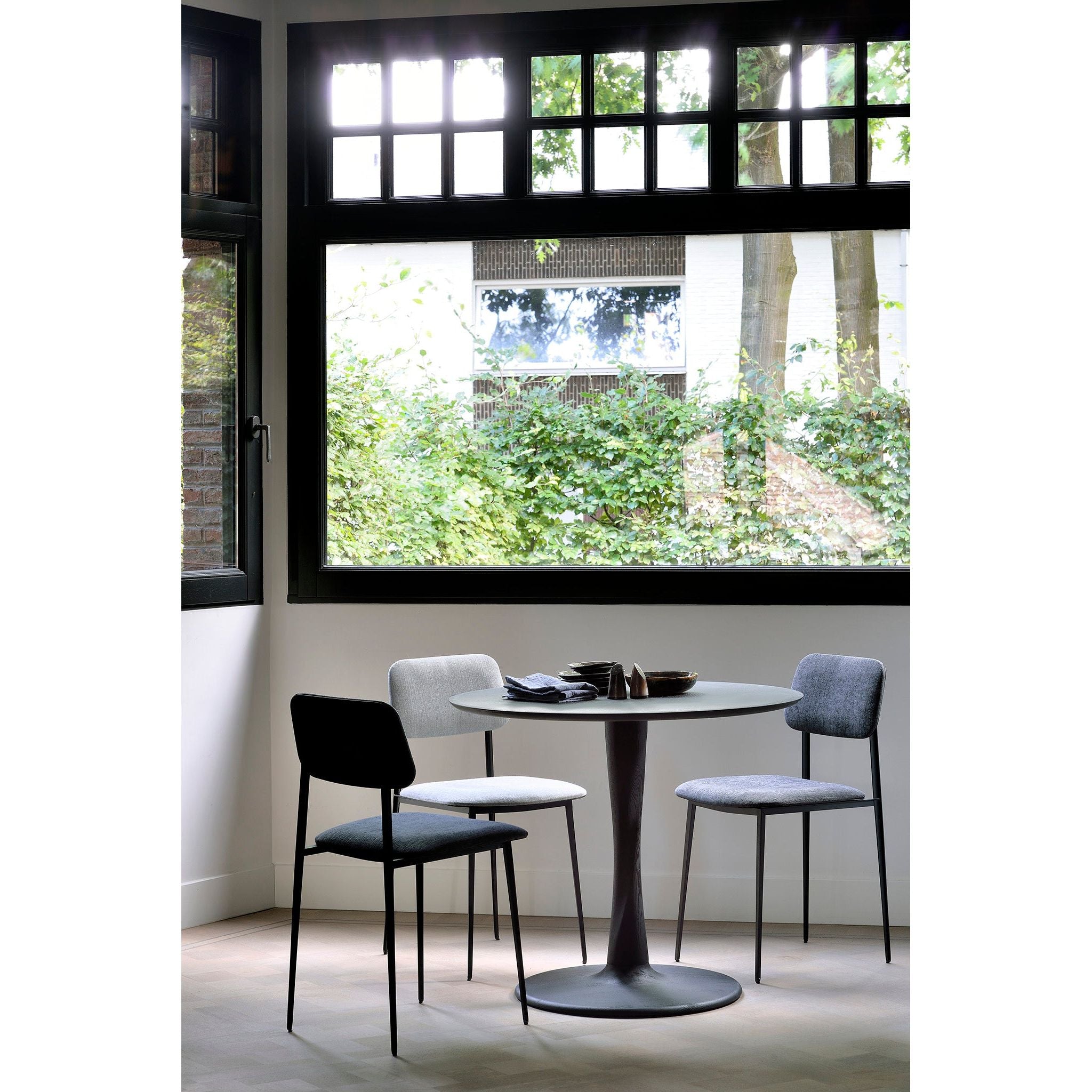 Featuring Oak Round Torsion Dining Table - Black by Ethnicraft at Amethyst Home. We love the modern, sleek look of this Oak Torsion Dining Table - Black. The varnish finish gives more depth, with the rougher surface highlighting the grain of the wood.
Dimensions 28": 28"w x 28"d x 30"h Weight: 46 lbs
Dimensions 35.5": 35.5"w x 25.5" x 30"hWeight: 73 lbs
D.  Amethyst Home provides interior design, new home construction design consulting, vintage area rugs, and lighting in the Des Moines metro area.