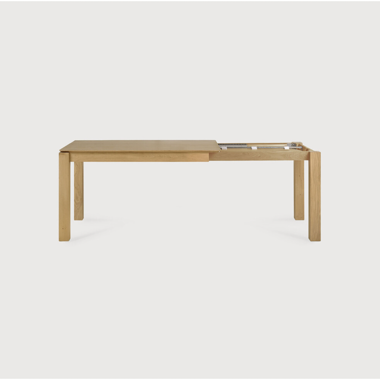 Featuring Oak Slice Extendable Dining Table by Ethnicraft at Amethyst Home. This Oak Slice Extendable Dining Table bevelled edges give it a unique character, but there's also a little extra added. This table can easily be extended without interruption of the wood grain pattern -- perfect for gathering your family or friends for hosting parties or the hol.  Amethyst Home provides interior design, new home construction design consulting, vintage area rugs, and lighting in the Kansas City metro area.