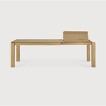 Featuring Oak Slice Extendable Dining Table by Ethnicraft at Amethyst Home. This Oak Slice Extendable Dining Table bevelled edges give it a unique character, but there's also a little extra added. This table can easily be extended without interruption of the wood grain pattern -- perfect for gathering your family or friends for hosting parties or the holiday.  Amethyst Home provides interior design, new home construction design consulting, vintage area rugs, and lighting in the Houston metro area.