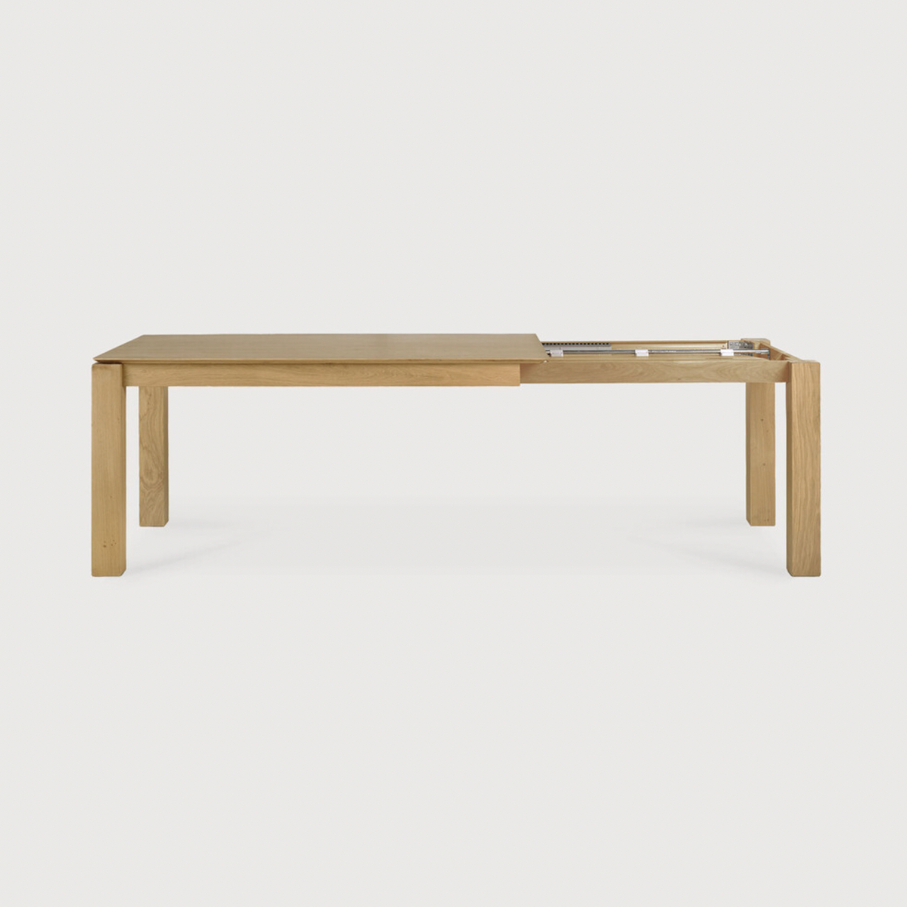 Featuring Oak Slice Extendable Dining Table by Ethnicraft at Amethyst Home. This Oak Slice Extendable Dining Table bevelled edges give it a unique character, but there's also a little extra added. This table can easily be extended without interruption of the wood grain pattern -- perfect for gathering your family or friends for hosting parties or the holi.  Amethyst Home provides interior design, new home construction design consulting, vintage area rugs, and lighting in the Scottsdale metro area.