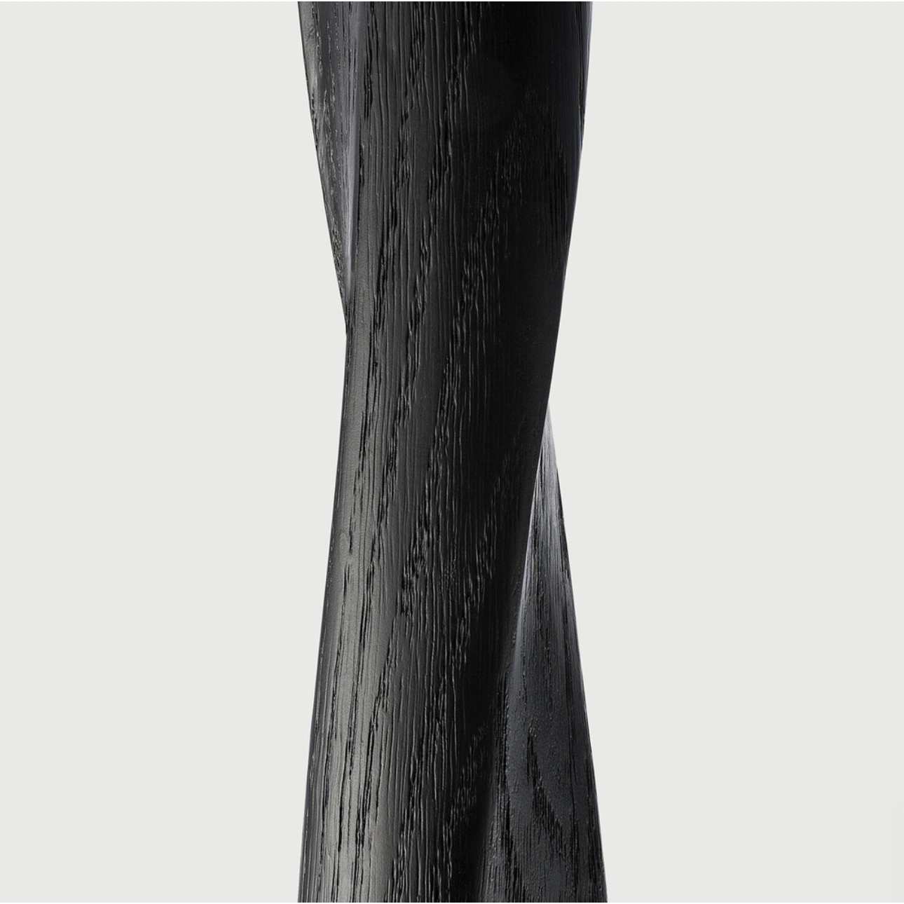 We love the modern, sleek look of this Oak Torsion 28" Dining Table - Black. The varnish finish gives more depth, with the rougher surface highlighting the grain of the wood.  Dimensions: 28"w x 28"d x 30"h  Material: Oak  Finish: Varnished