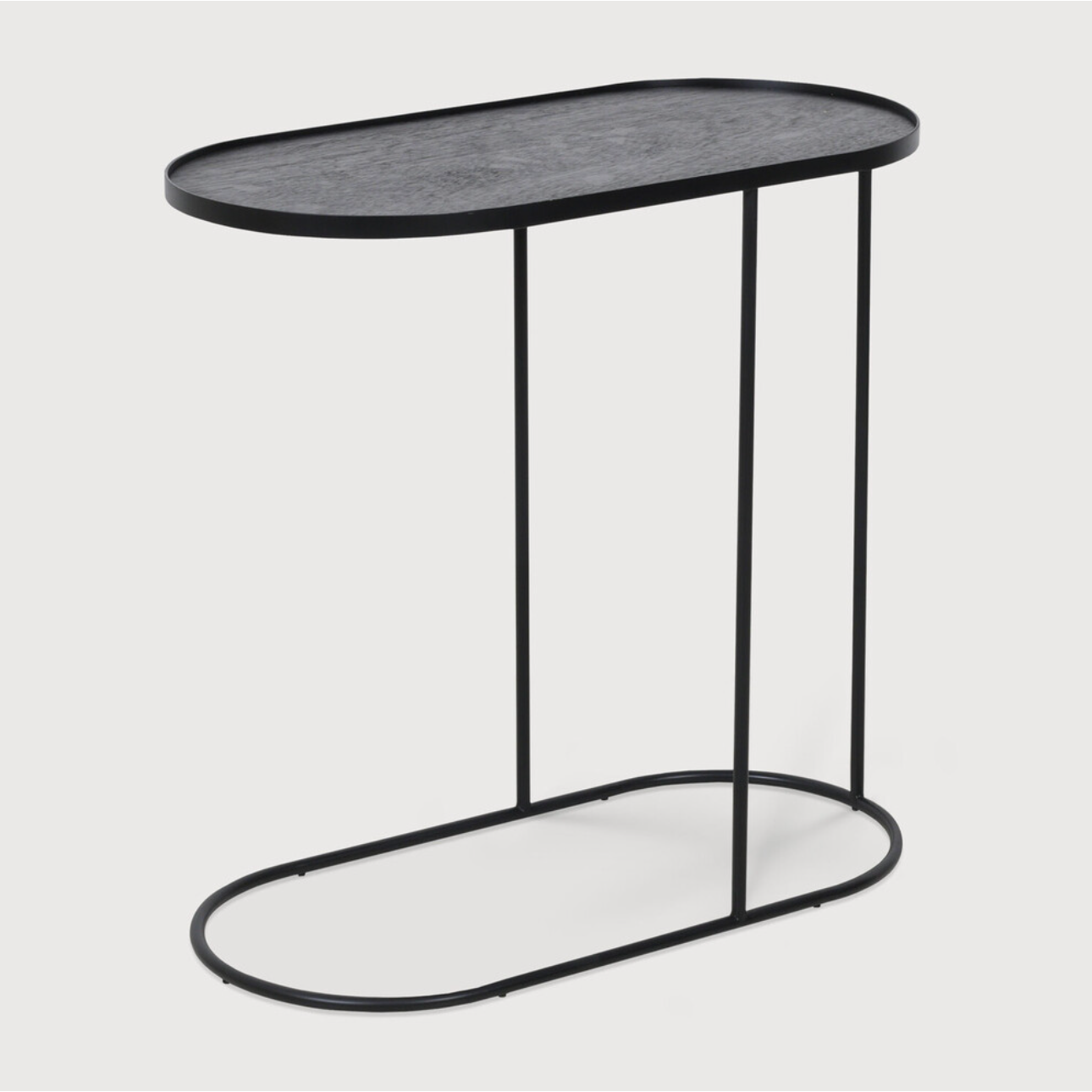 We love that this Oblong Tray Side Table has the ability to adopt different trays to mix or match various colors and patterns, creating a personal piece that is uniquely yours!  Dimensions: 27.5"w x 13"d x 26"h   Material: Metal 
