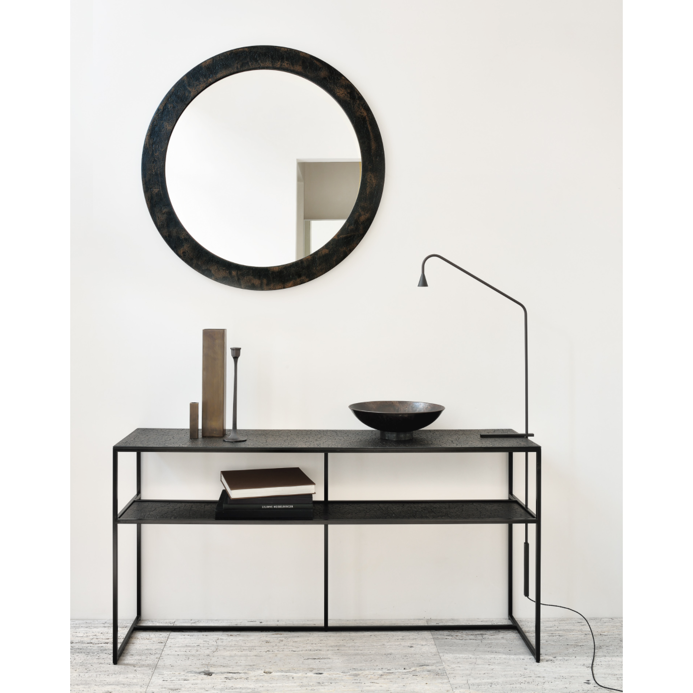 The deep surface of the Pentagon console is shaped by hand by skilled artisans. Natural mineral powders and color pigments blend to form the console's unique finish. We love how this piece's simple lines showcase the clean beauty of well-crafted metal work. We imagine this unique piece in your entry hall or behind your sofa where the two shelves offer so much space to display the items you love!  Dimensions: 59.5"w x 16"d x 30"h  Weight: 78 lbs  Material: Minerals Finish: Varnished 