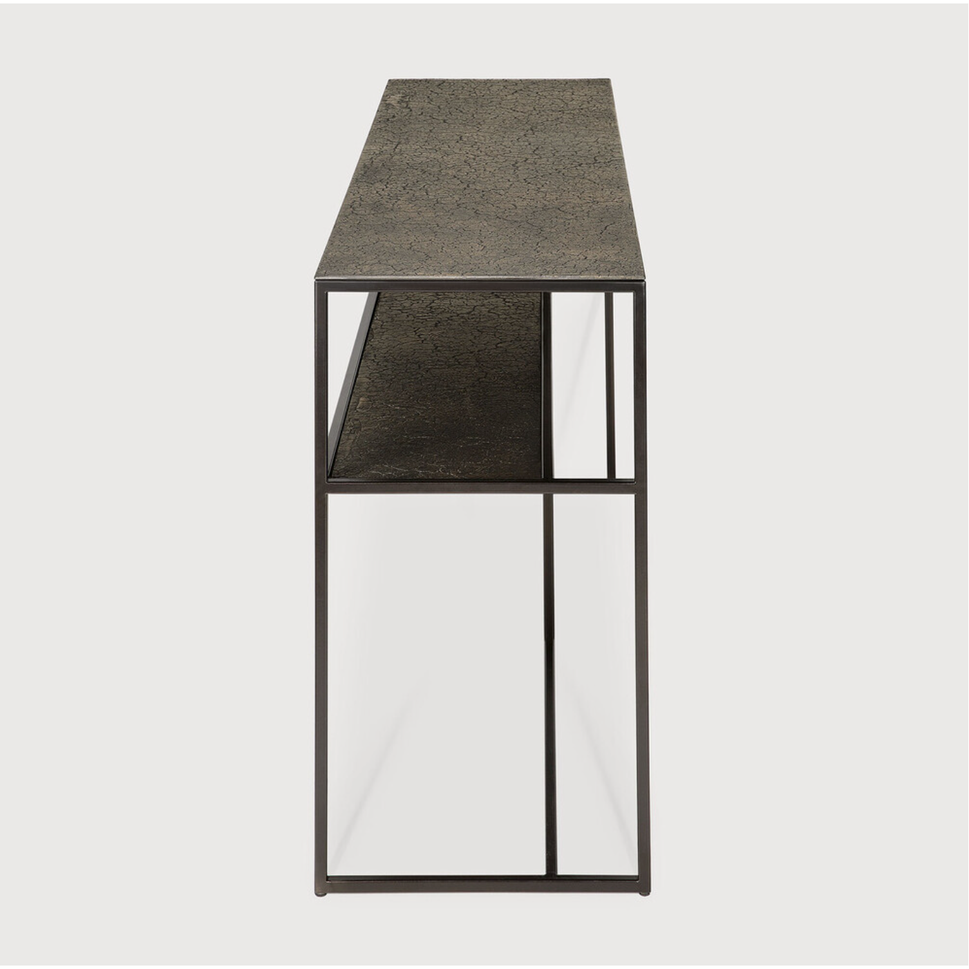 The deep surface of the Pentagon console is shaped by hand by skilled artisans. Natural mineral powders and color pigments blend to form the console's unique finish. We love how this piece's simple lines showcase the clean beauty of well-crafted metal work. We imagine this unique piece in your entry hall or behind your sofa where the two shelves offer so much space to display the items you love!  Dimensions: 59.5"w x 16"d x 30"h  Weight: 78 lbs  Material: Minerals Finish: Varnished 