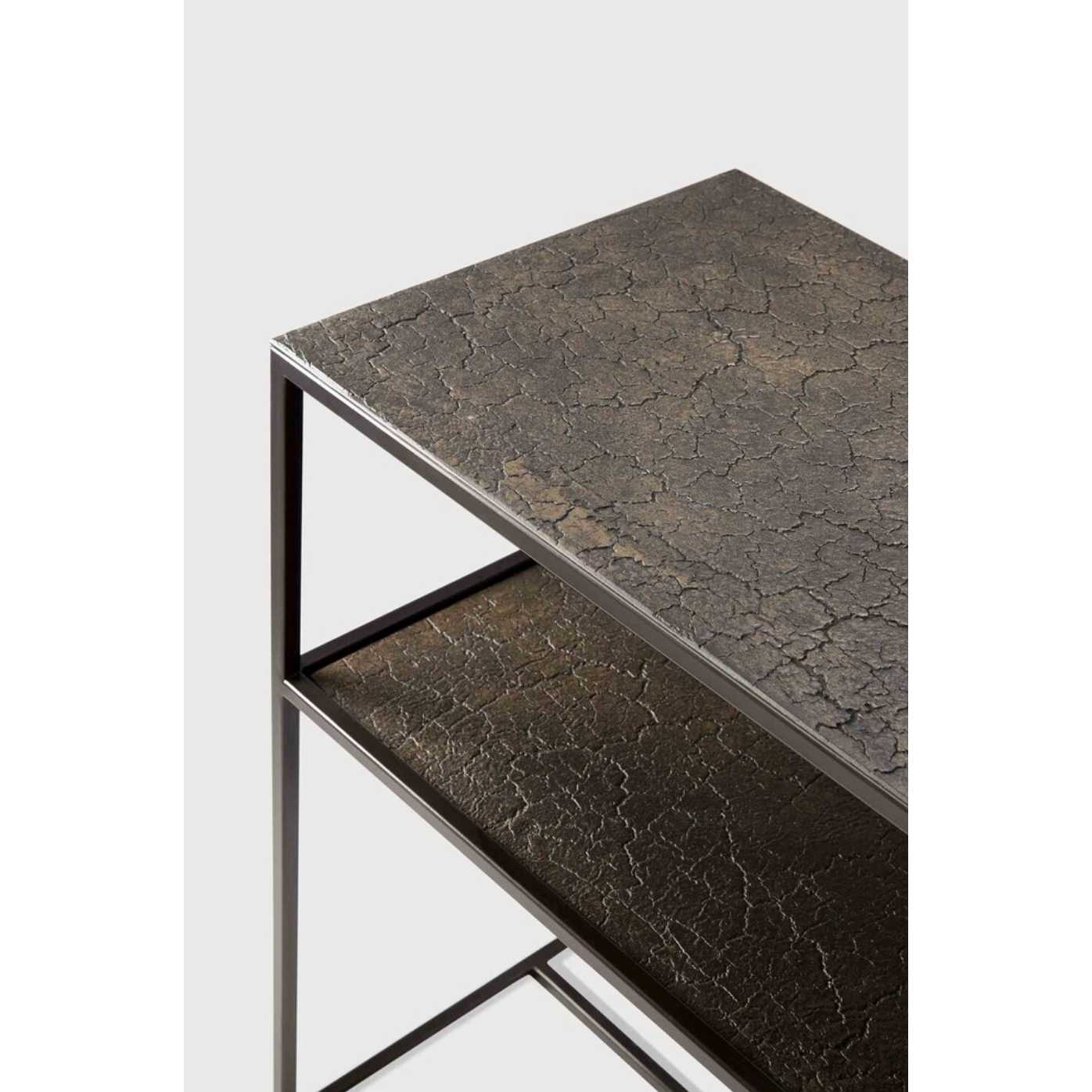 The deep surface of the Pentagon console is shaped by hand by skilled artisans. Natural mineral powders and color pigments blend to form the console's unique finish. We love how this piece's simple lines showcase the clean beauty of well-crafted metal work. We imagine this unique piece in your entry hall or behind your sofa where the two shelves offer so much space to display the items you love!  Dimensions: 59.5"w x 16"d x 30"h  Weight: 78 lbs  Material: Minerals Finish: Varnished 