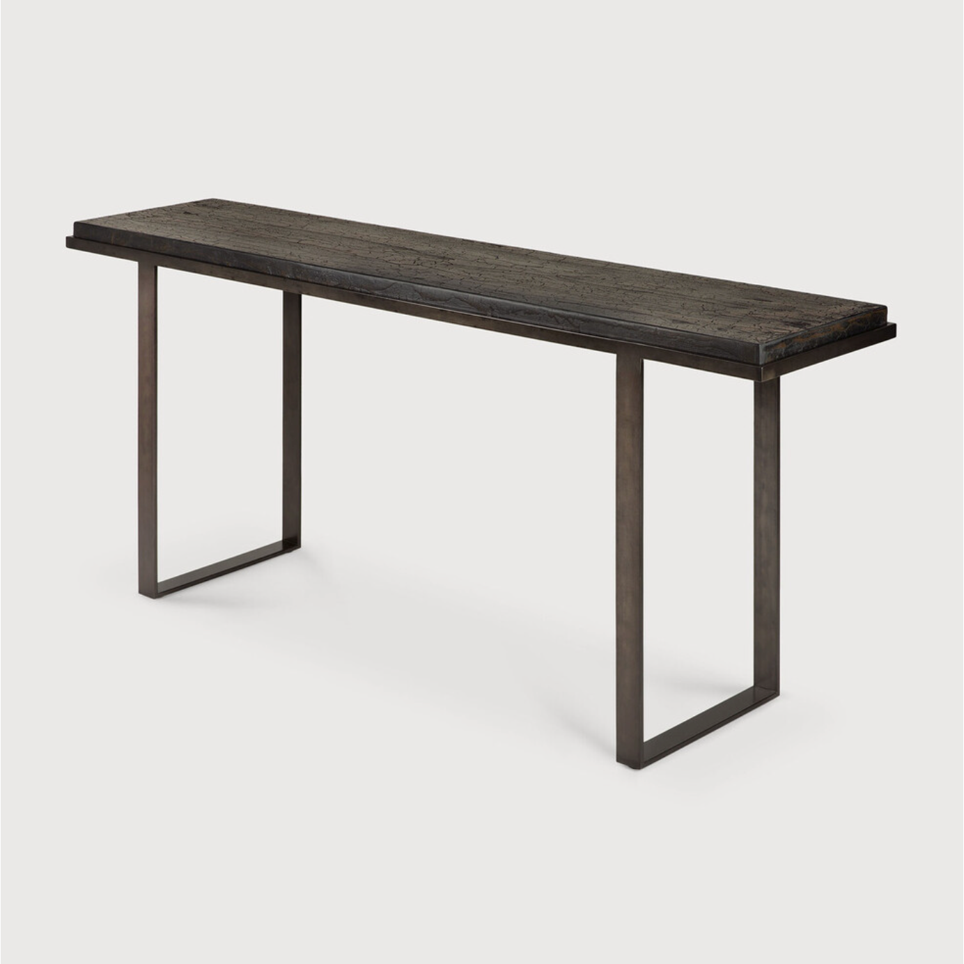 Featuring Stability Console Table - Umber by Ethnicraft at Amethyst Home. The deep surface of the Stability console is shaped by hand by skilled artisans. Natural mineral powders and color pigments blend to form the console's unique finish. We love how this piece's simple lines showcase the clean beauty of well-crafted metal work. We imagine this unique piec.  Amethyst Home provides interior design, new home construction design consulting, vintage area rugs, and lighting in the Houston metro area.