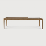 This Oak Bok Extendable Dining Table is perfect for families who want extra space when their kids, extended family, or guests come to celebrate! Its airy shape yet rock solid construction make this piece a timeless and remarkable design to enjoy for years to come.  Material: Oak, 100% Solid Wood Finish: Oiled