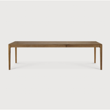 This Oak Bok Extendable Dining Table is perfect for families who want extra space when their kids, extended family, or guests come to celebrate! Its airy shape yet rock solid construction make this piece a timeless and remarkable design to enjoy for years to come.  Material: Oak, 100% Solid Wood Finish: Oiled