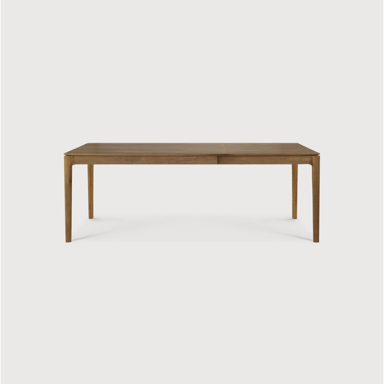 This Oak Bok Extendable Dining Table is perfect for families who want extra space when their kids, extended family, or guests come to celebrate! Its airy shape yet rock solid construction make this piece a timeless and remarkable design to enjoy for years to come.  Material: Oak, 100% Solid Wood Finish: Oiled