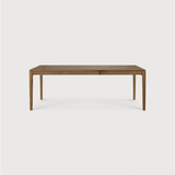 This Oak Bok Extendable Dining Table is perfect for families who want extra space when their kids, extended family, or guests come to celebrate! Its airy shape yet rock solid construction make this piece a timeless and remarkable design to enjoy for years to come.  Material: Oak, 100% Solid Wood Finish: Oiled