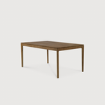 This Oak Bok Extendable Dining Table is perfect for families who want extra space when their kids, extended family, or guests come to celebrate! Its airy shape yet rock solid construction make this piece a timeless and remarkable design to enjoy for years to come.  Material: Oak, 100% Solid Wood Finish: Oiled
