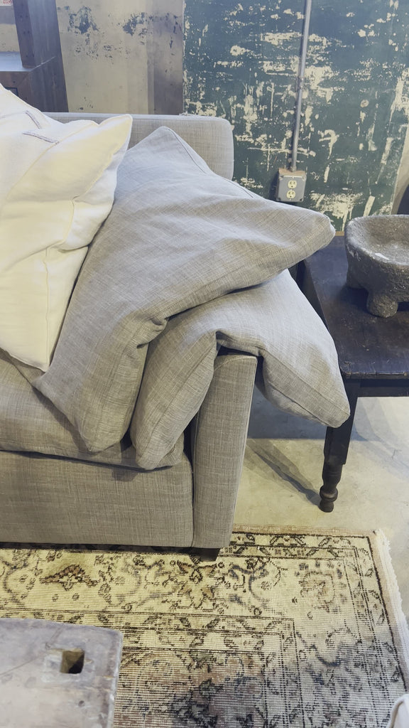 This cozy Donato Sofa from Cisco Brothers is our favorite! As shown slipcovered in Mariet White 100% linen fabric. Amethyst Home provides interior design, new home construction design consulting, vintage area rugs, and lighting in the Kansas City metro area.