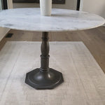 The Lucy Round Marble Dining Table from Four Hands beautifully captures the French industrial meets dining table vibe. Beautifully detailed, 8-sided cast iron pedestal supports a dramatic white marble top with a bull-nosed edge.  Size: 48"w x 48"d x 30"h