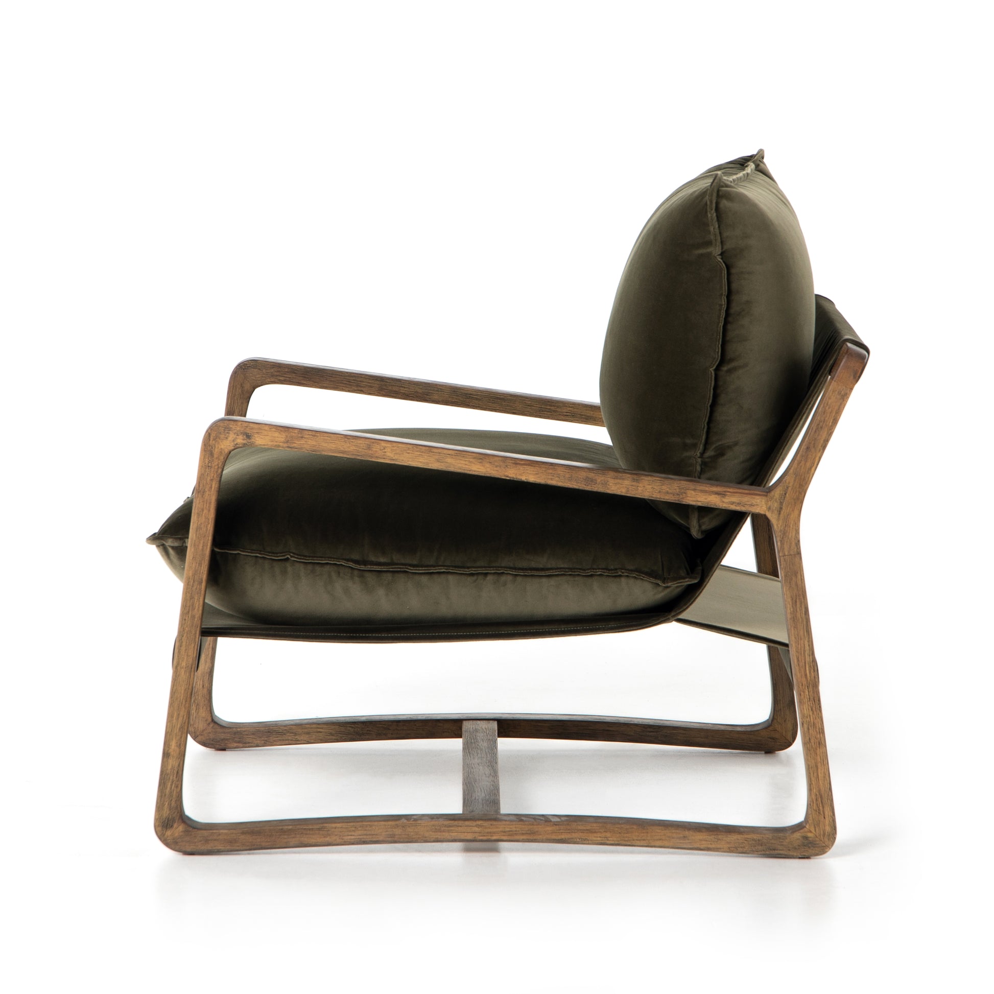 This Ace Chair in Olive Green has a comfortable, cushy seat for the perfect place to curl up with a good book. A hand-shaped oak frame supports deep, low-style seating covered in soft, olive-colored cotton - sure to elevate the look of any living room or office. Amethyst Home provides interior design, new home construction design consulting, vintage area rugs, and lighting in the Nashville metro area.