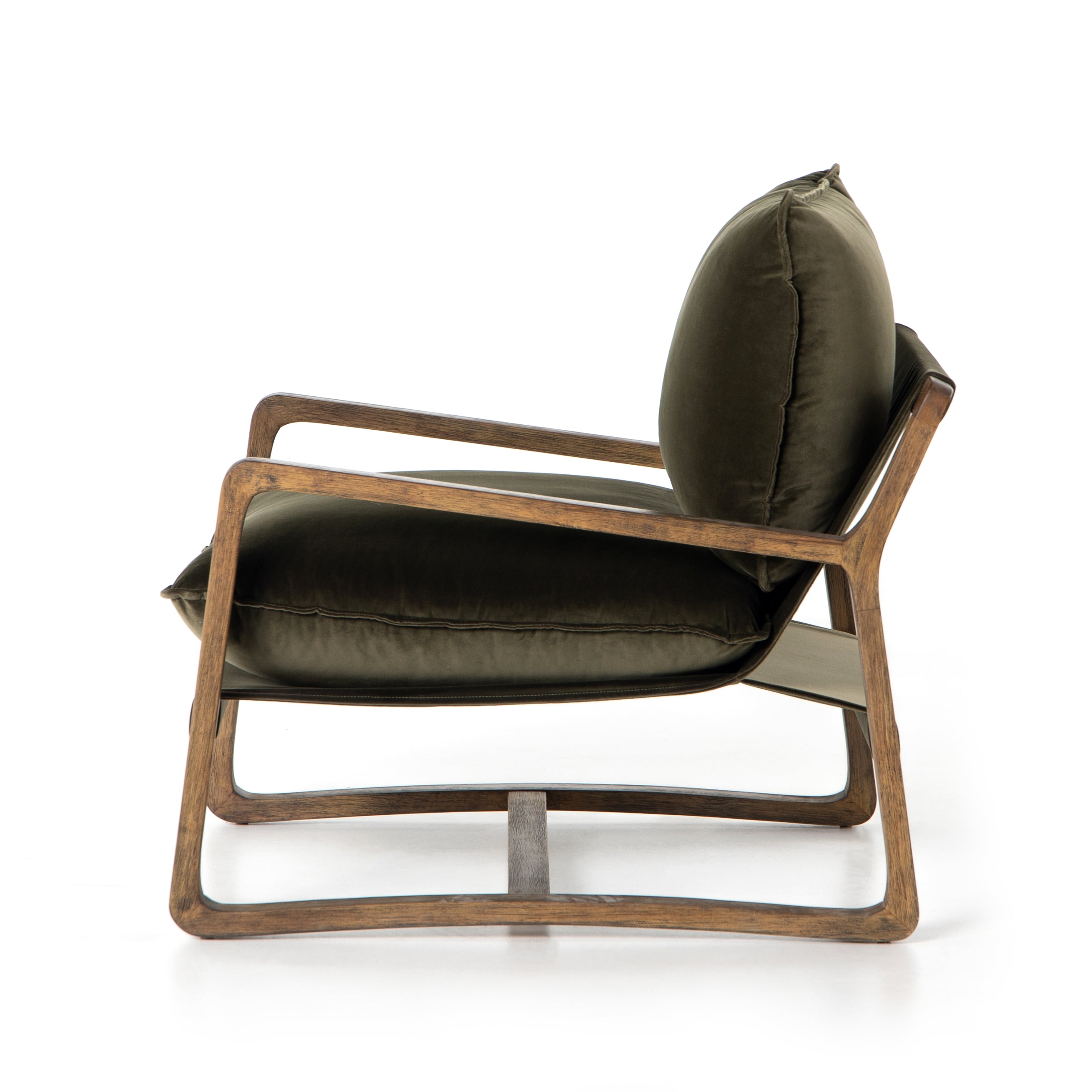 This Ace Chair in Olive Green has a comfortable, cushy seat for the perfect place to curl up with a good book. A hand-shaped oak frame supports deep, low-style seating covered in soft, olive-colored cotton - sure to elevate the look of any living room or office. Amethyst Home provides interior design, new home construction design consulting, vintage area rugs, and lighting in the Nashville metro area.