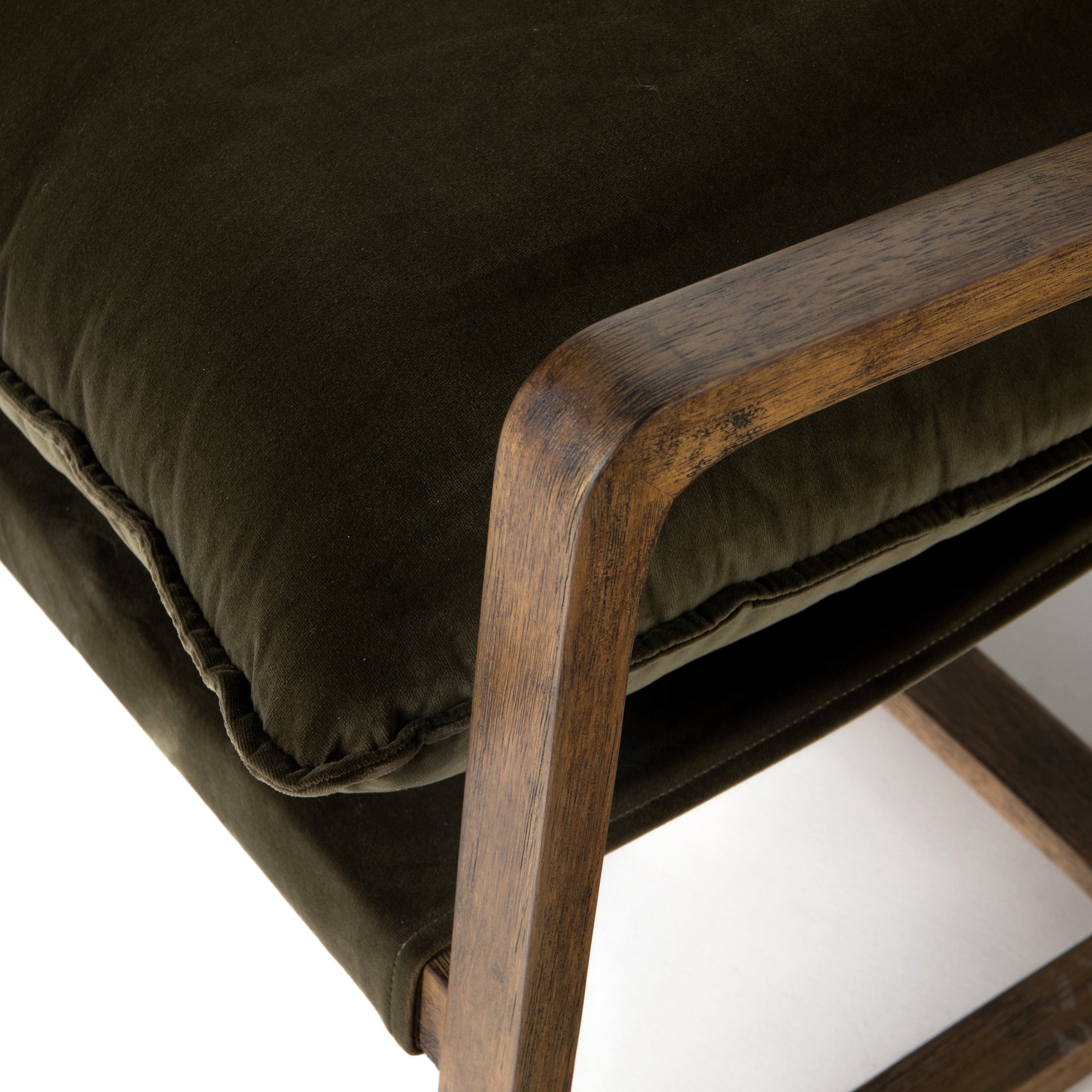 This Ace Chair in Olive Green has a comfortable, cushy seat for the perfect place to curl up with a good book. A hand-shaped oak frame supports deep, low-style seating covered in soft, olive-colored cotton - sure to elevate the look of any living room or office. Amethyst Home provides interior design, new home construction design consulting, vintage area rugs, and lighting in the San Diego metro area.