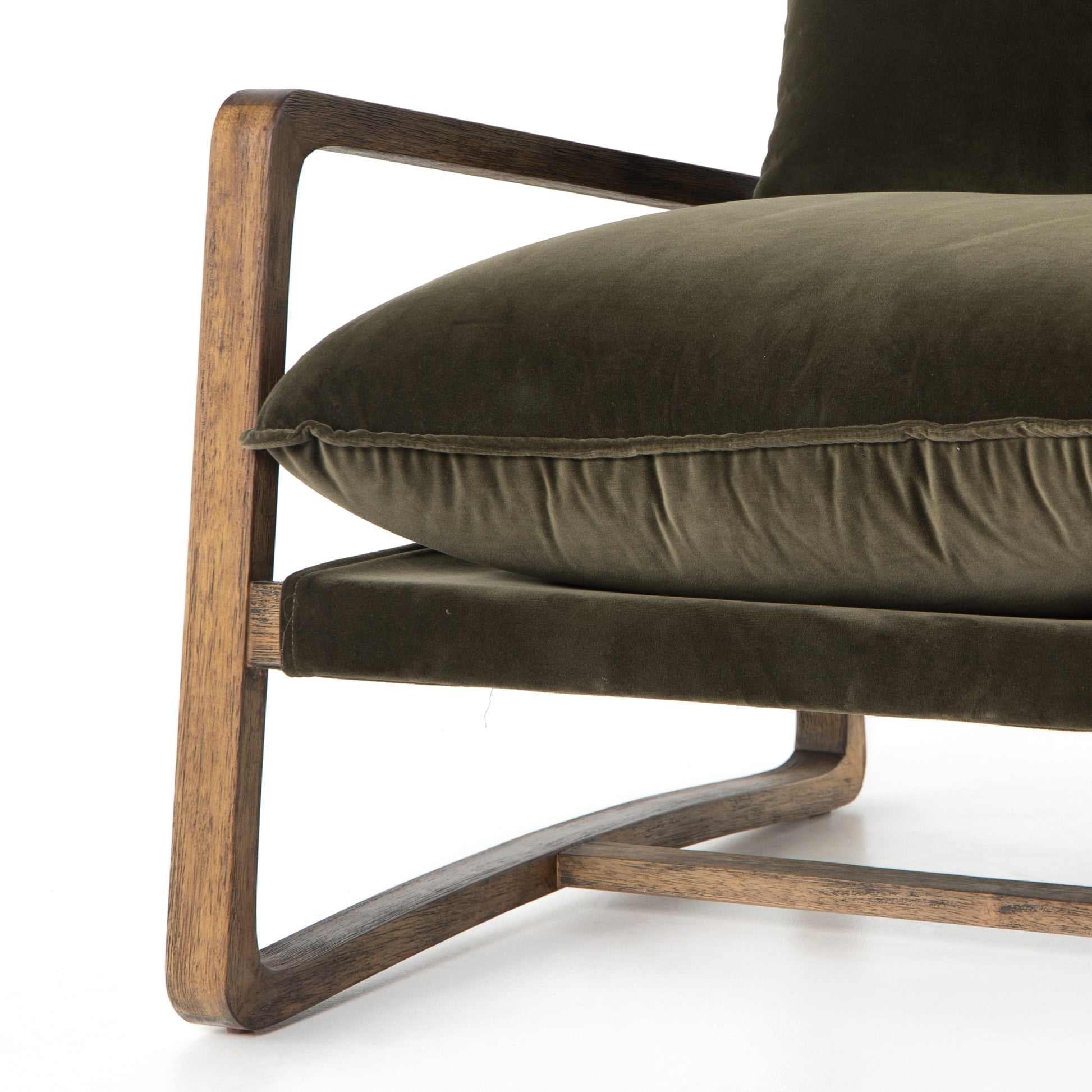 This Ace Chair in Olive Green has a comfortable, cushy seat for the perfect place to curl up with a good book. A hand-shaped oak frame supports deep, low-style seating covered in soft, olive-colored cotton - sure to elevate the look of any living room or office. Amethyst Home provides interior design, new home construction design consulting, vintage area rugs, and lighting in the Kansas City metro area.