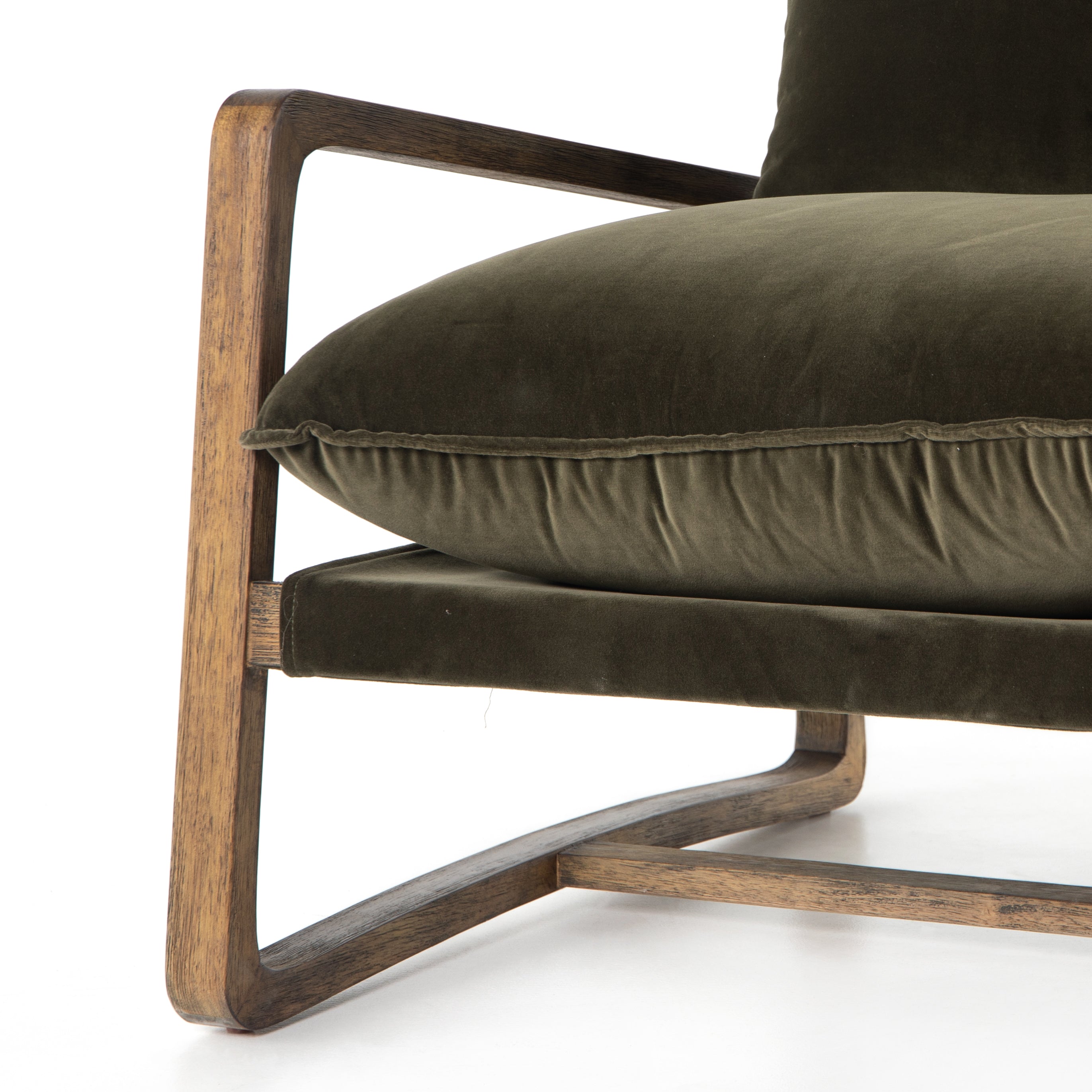 This Ace Chair in Olive Green has a comfortable, cushy seat for the perfect place to curl up with a good book. A hand-shaped oak frame supports deep, low-style seating covered in soft, olive-colored cotton - sure to elevate the look of any living room or office. Amethyst Home provides interior design, new home construction design consulting, vintage area rugs, and lighting in the Kansas City metro area.