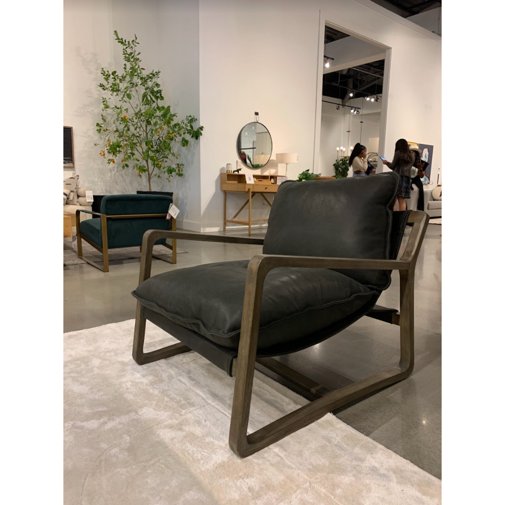 This Ace Chair - Umber Black is the perfect place to relax or curl up with a good book. Hand-shaped oak frame supports deep, low seating covered in black top-grain leather for a comfortable seat in any living room or office.   Overall Dimensions: 30.00"w x 37.00"d x 31.00"h