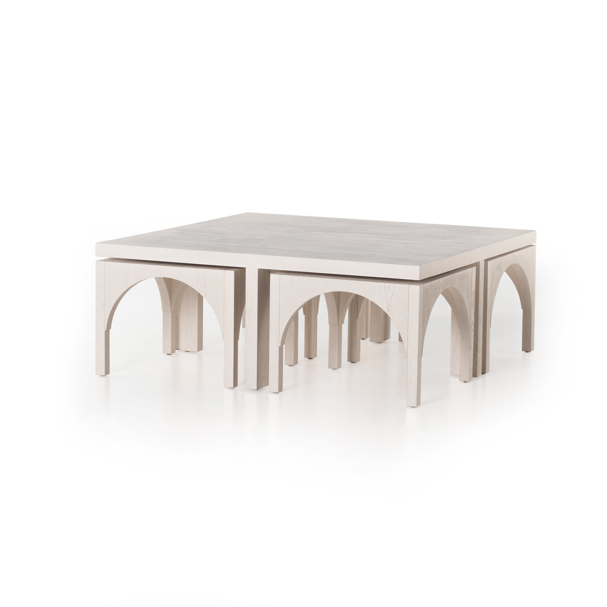 Meet a forward-thinking oak coffee table as stylish as it is functional with this Amara Coffee Table. We love the beautifully arched sides with four separate nesting tables that slide out to create ample extra surfaces as needed, tucking back under with ease.  Overall Dimensions: 47.25"w x 47.25"d x 18.00"h