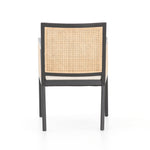 Featuring Antonia Cane Brushed Ebony Dining Armchair by Four Hands at Amethyst Home. We loved the retro look of this Antonia Cane Dining Armchair - Brushed Ebony. The brushed ebony nettlewood frames paired with the natural cane brings the perfect contract to any dining room or kitchen area. 
Overall Dimensions: 22.75"W x 23.50"L x 33"HColors: Light Natu.  Amethyst Home provides interior design, new home construction design consulting, vintage area rugs, and lighting in the Laguna Beach metro area.